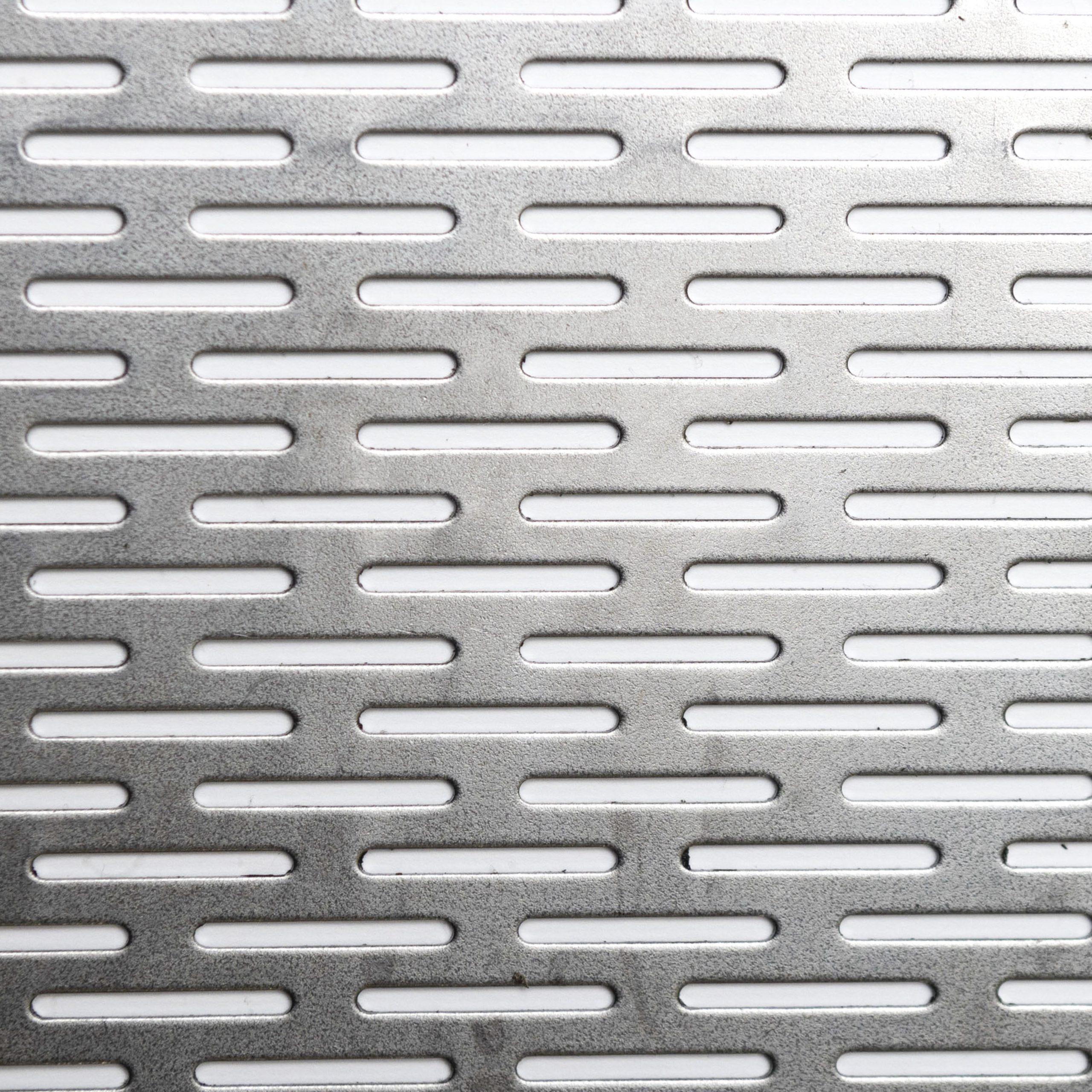 Chapa perforada oblonga para limpieza de granos